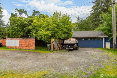 a view of backyard with a table and a couch