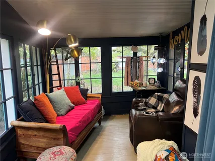 a living room with furniture fireplace and flat screen tv