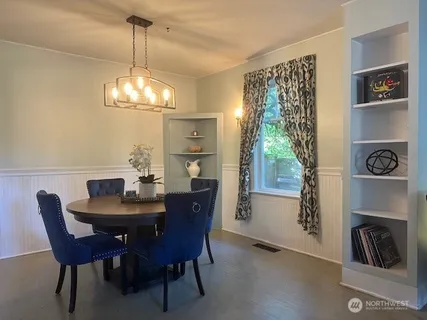 a view of a dining room with furniture window and outside view
