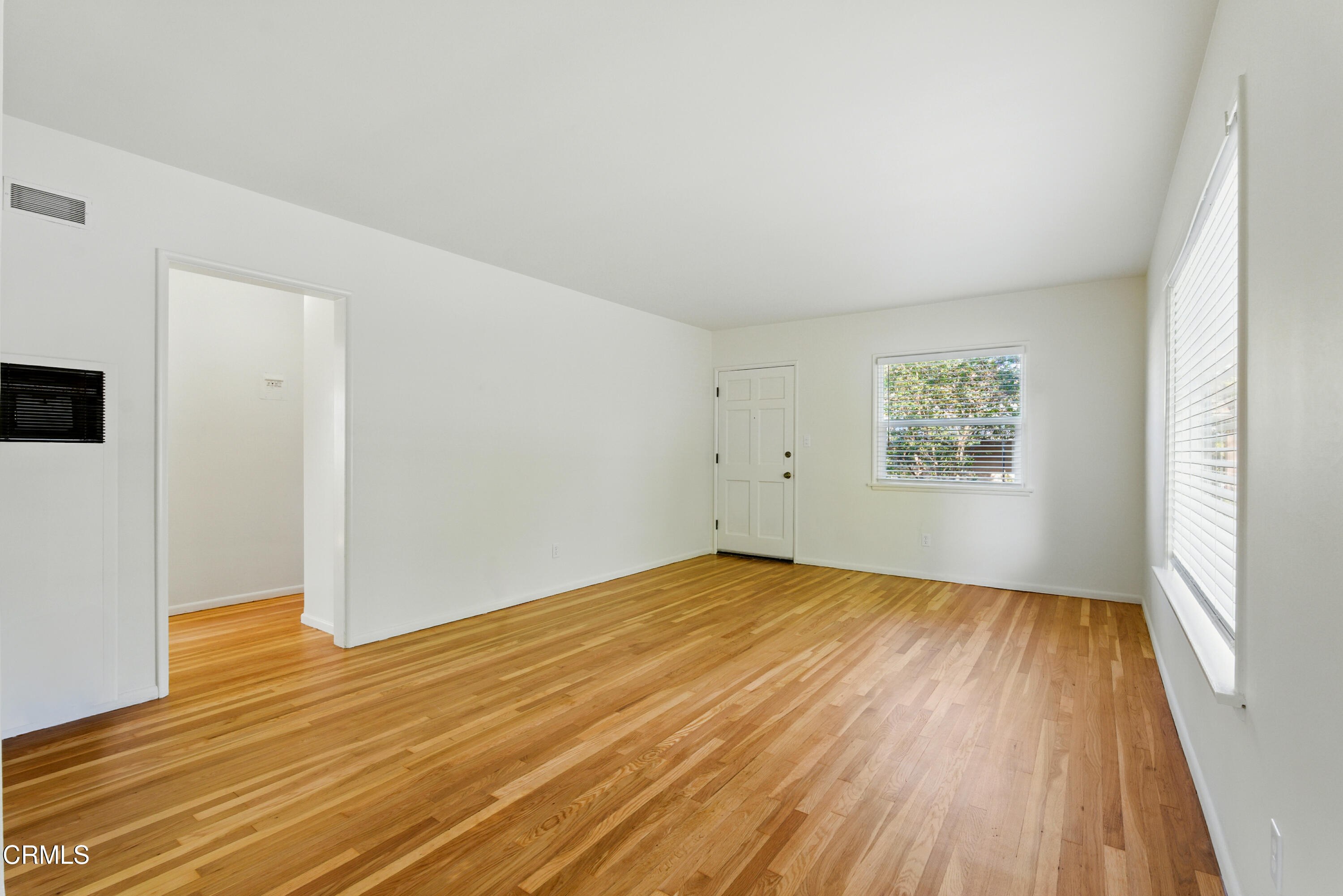 1545 Riverside Drive Glendale, CA 91201 - Photo 11 of 19 an empty room with wooden floor and windows