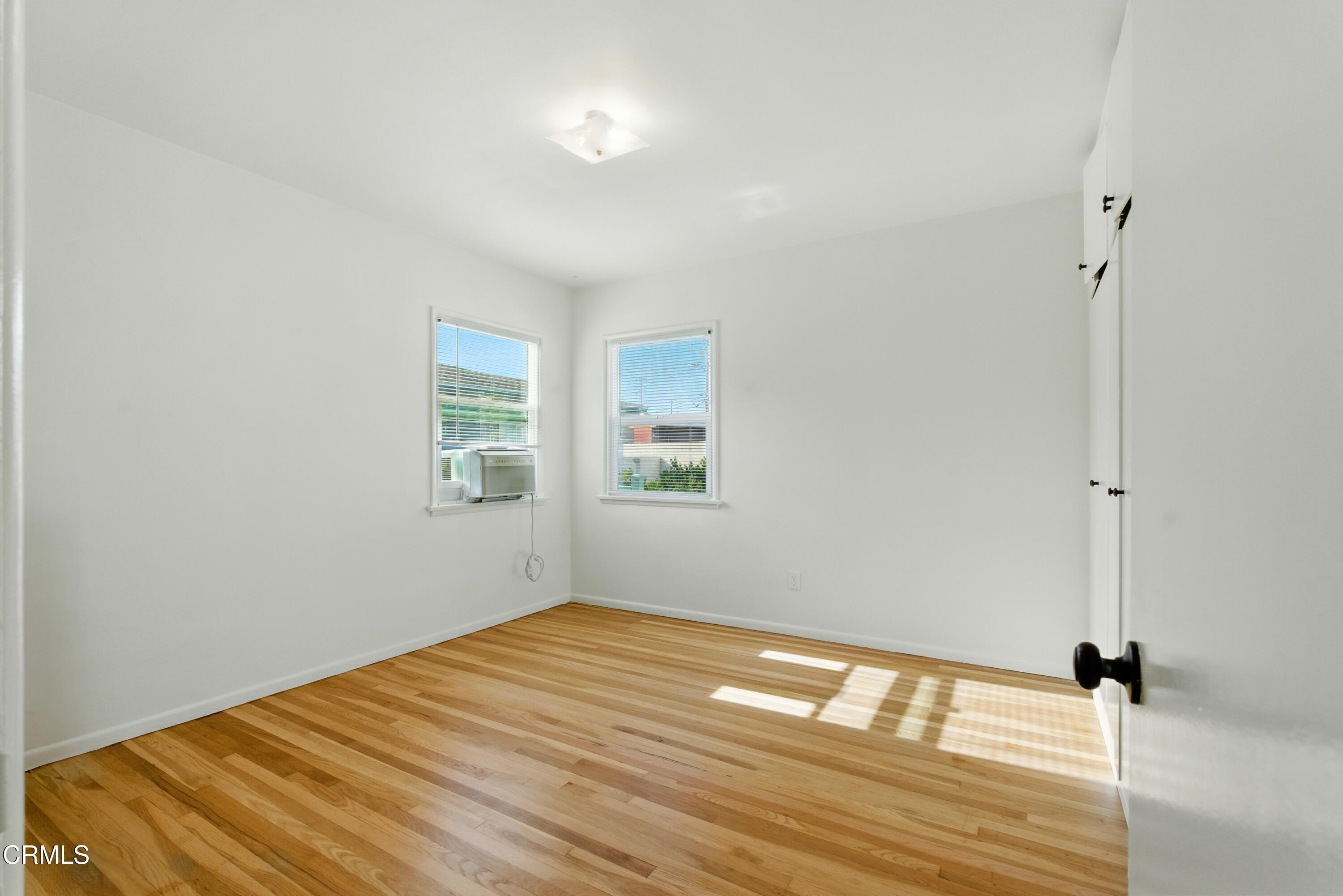 1545 Riverside Drive Glendale, CA 91201 - Photo 13 of 19 a view of empty room with wooden floor and fan