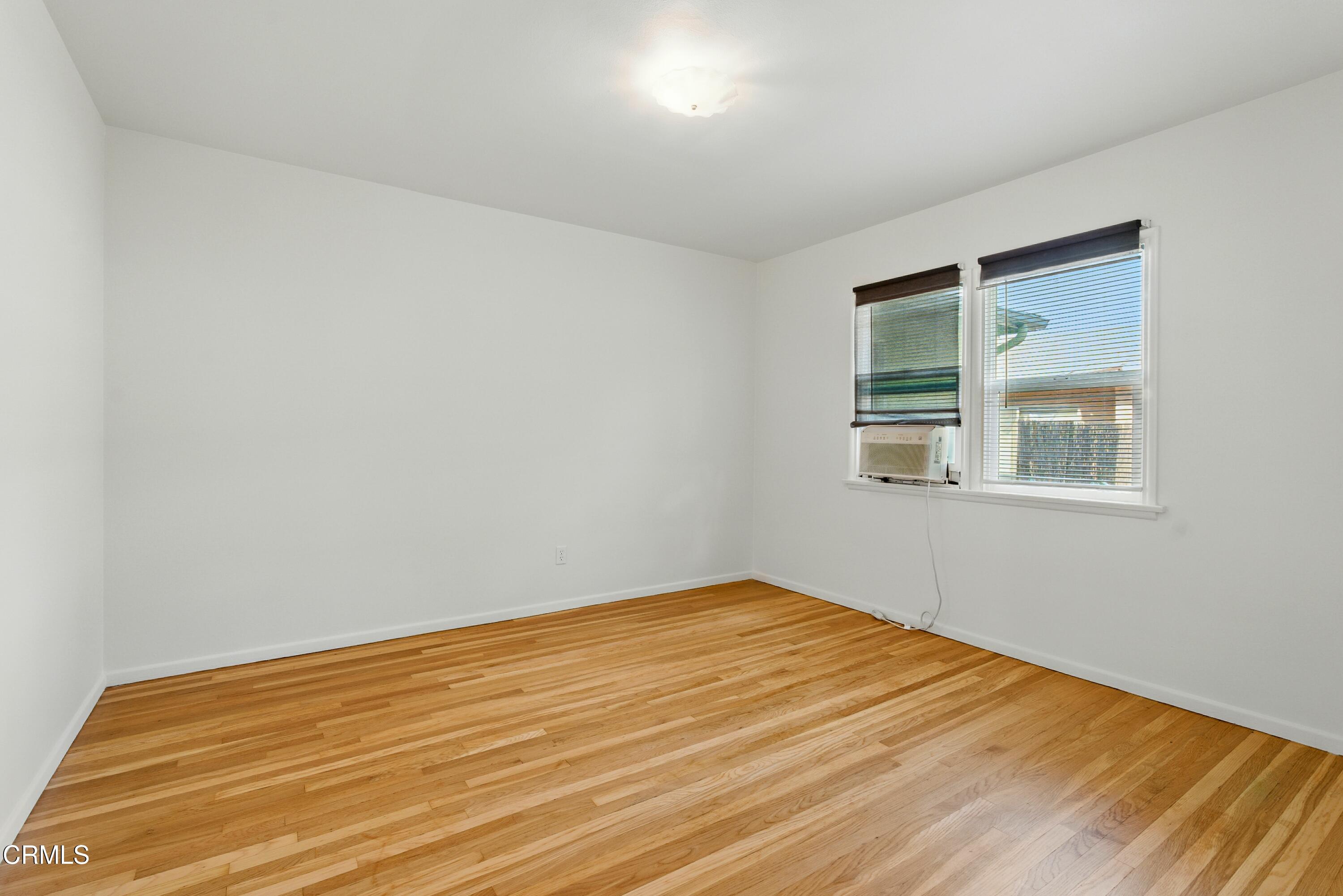1545 Riverside Drive Glendale, CA 91201 - Photo 15 of 19 a view of empty room with wooden floor and fan