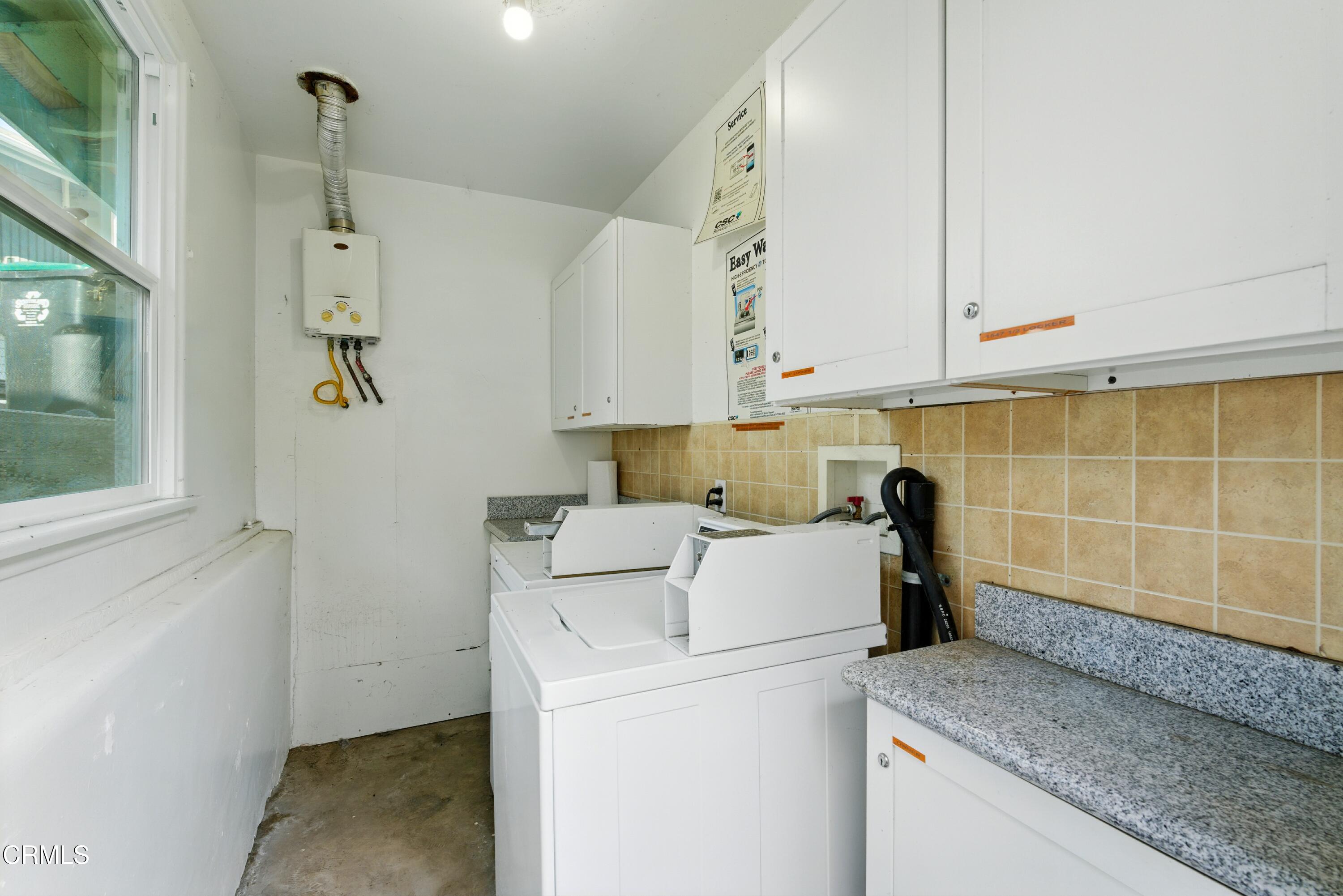 1545 Riverside Drive Glendale, CA 91201 - Photo 19 of 19 a view of bathroom with washing machine and cabinets