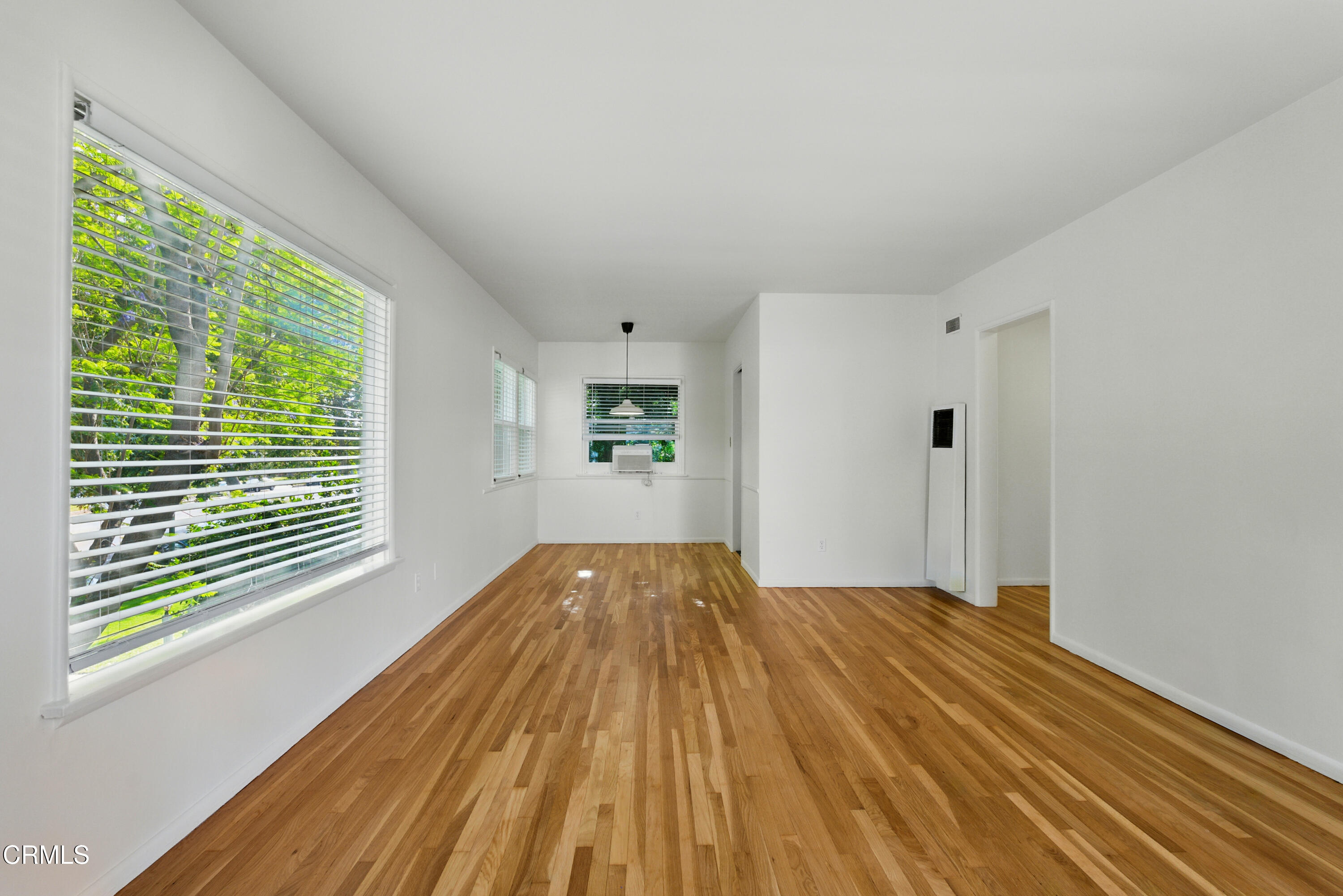 1545 Riverside Drive Glendale, CA 91201 - Photo 2 of 19 a view of empty room with wooden floor and fan