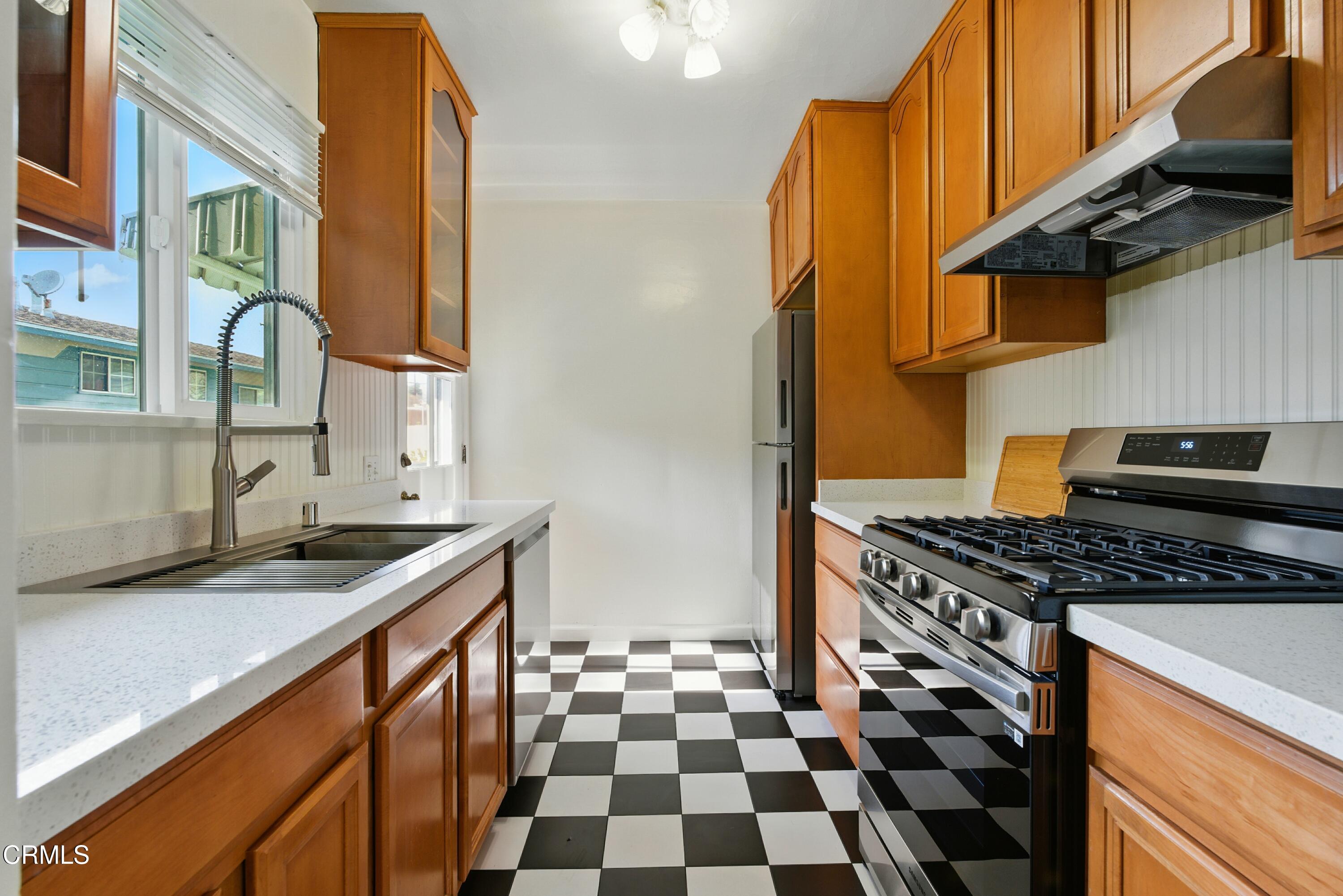 1545 Riverside Drive Glendale, CA 91201 - Photo 4 of 19 a kitchen with stainless steel appliances granite countertop a stove and a sink