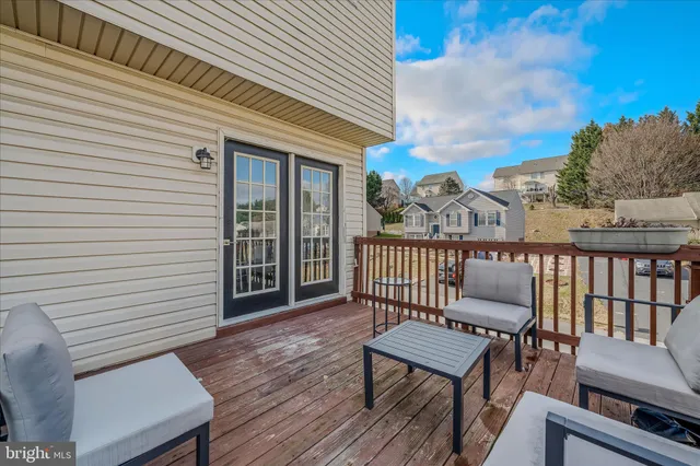 a view of a chairs in wooden deck