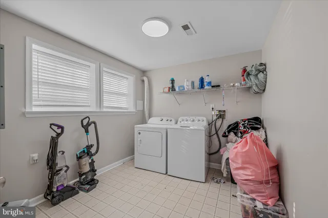 a utility room with a window dryer and washer