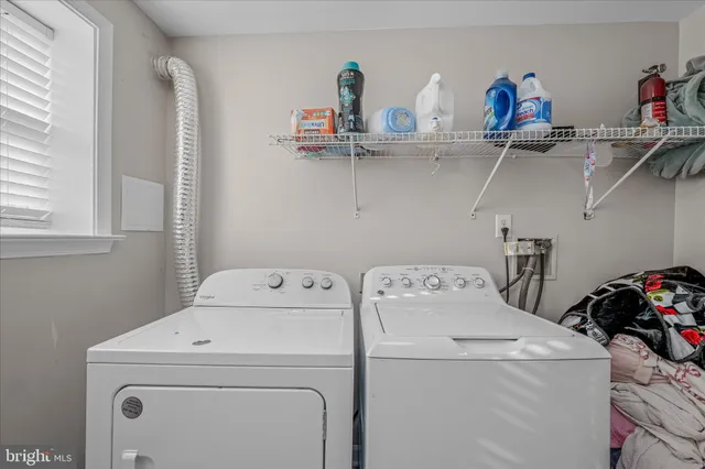 a view of storage and utility room with washer and dryer