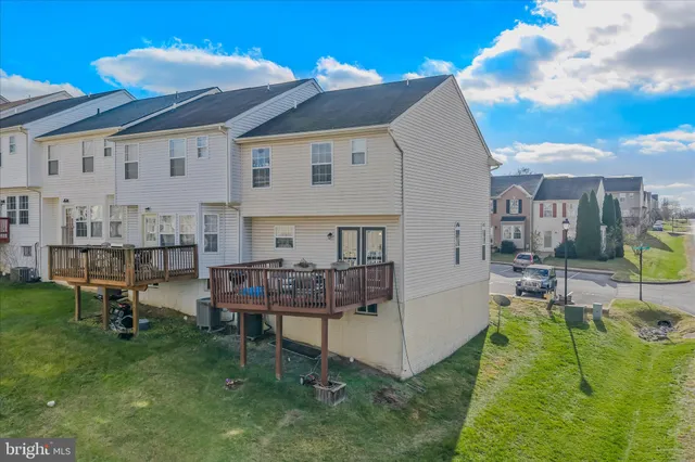 a aerial view of a house with swimming pool and sitting area
