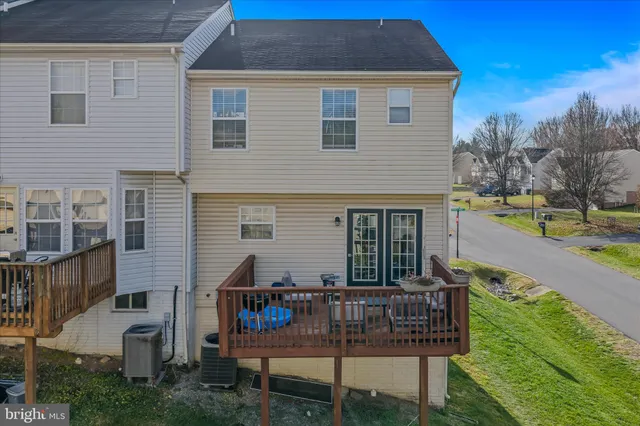 a view of house with outdoor seating area