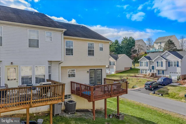 a front view of a house with garden and patio