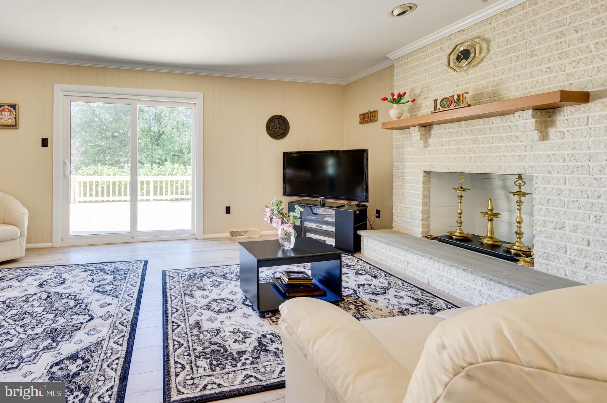 1775 Talbot Road Blue Bell, PA 19422 - Photo 11 of 22 Family room with fireplace and deck access