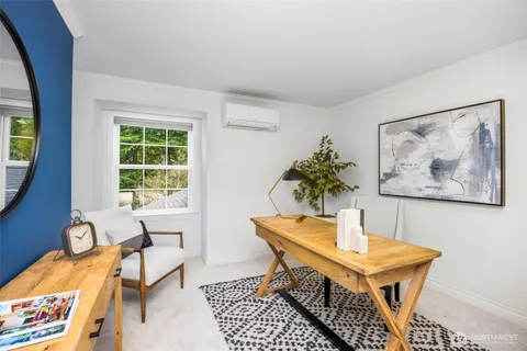 a bedroom with a bed and a couch