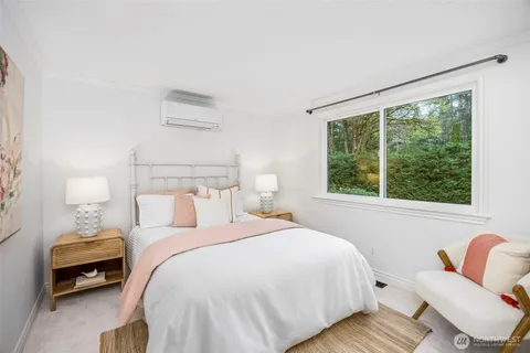 a bathroom with a granite countertop sink and a toilet