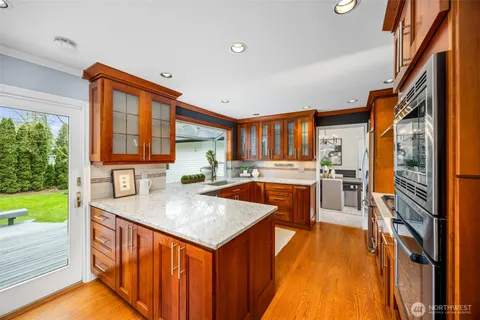 a kitchen with a sink stove and a refrigerator