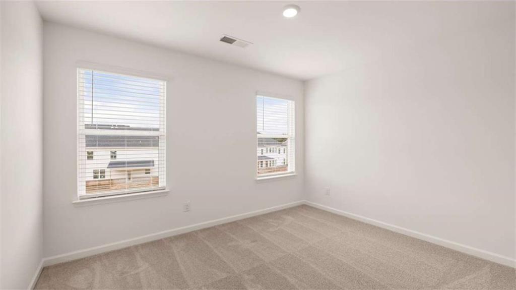 683 Edgar Hampton, GA 30228 - Photo 46 of 48 an empty room with windows