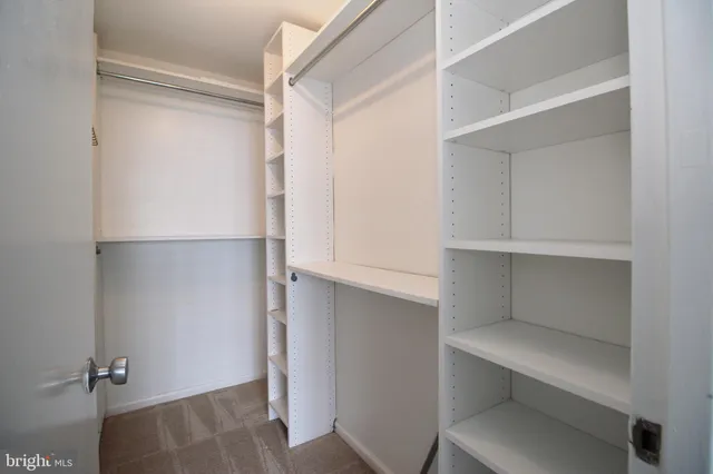a view of an empty walk in closet