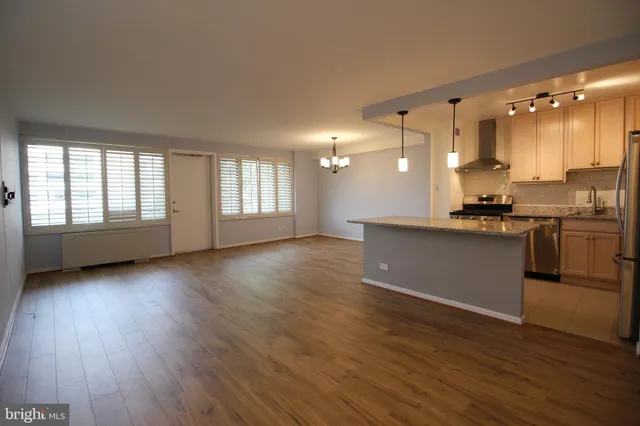 a view of a kitchen with a sink and a window