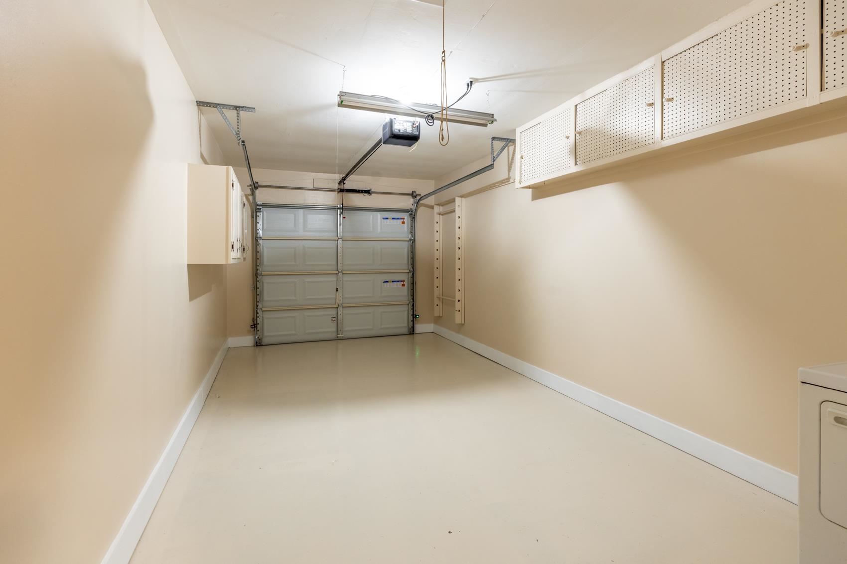 1820 West Holmes Road Memphis, TN 38109 - Photo 9 of 28 Garage with washer / clothes dryer and a garage door opener