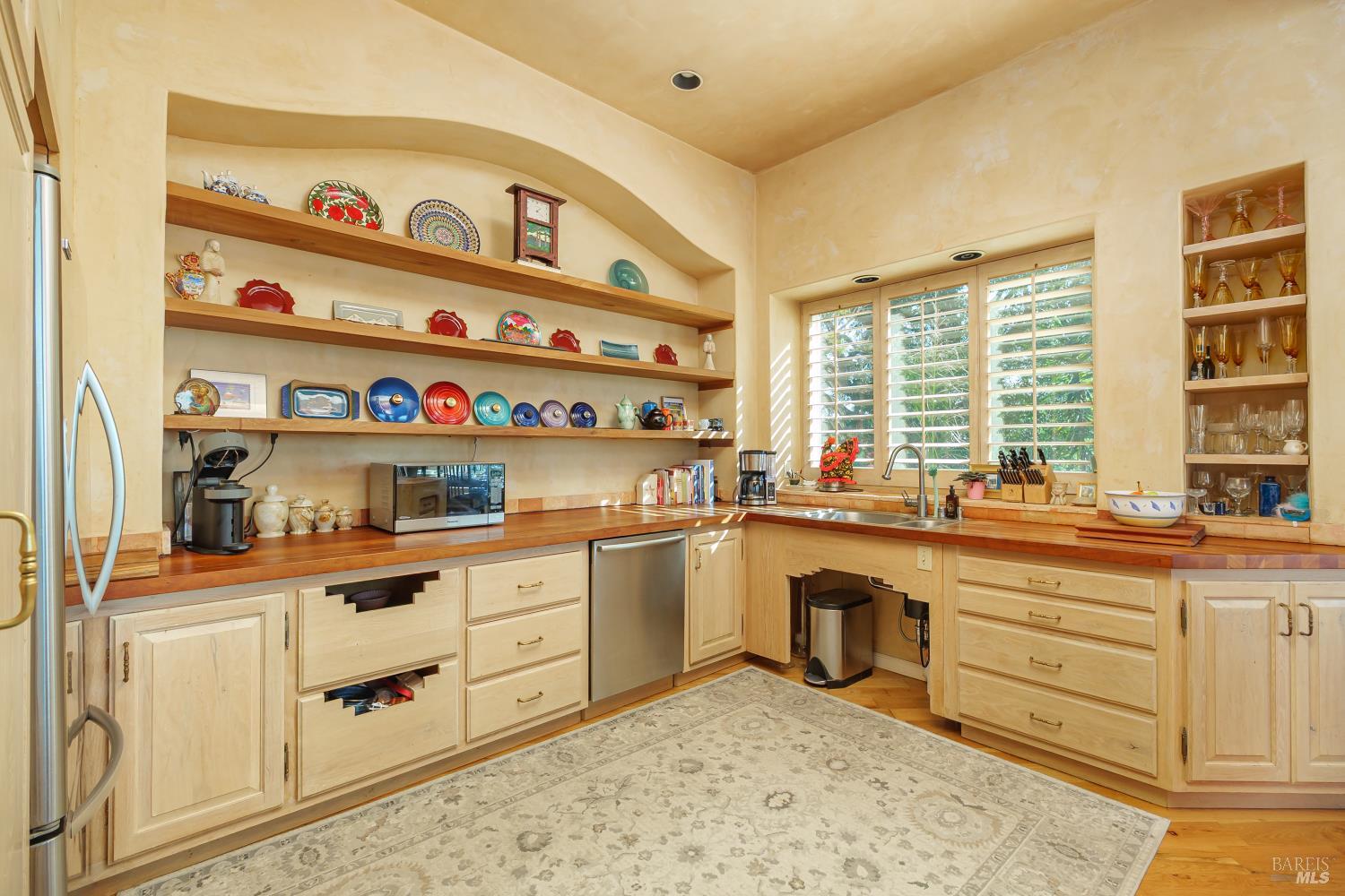 245 Water Street Richmond, CA 94801 - Photo 18 of 45 a kitchen with stainless steel appliances a sink and cabinets