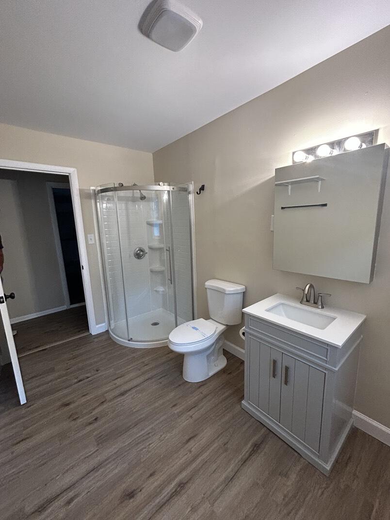 1359 State Street Hobart, IN 46342 - Photo 11 of 14 a bathroom with a sink a toilet and shower