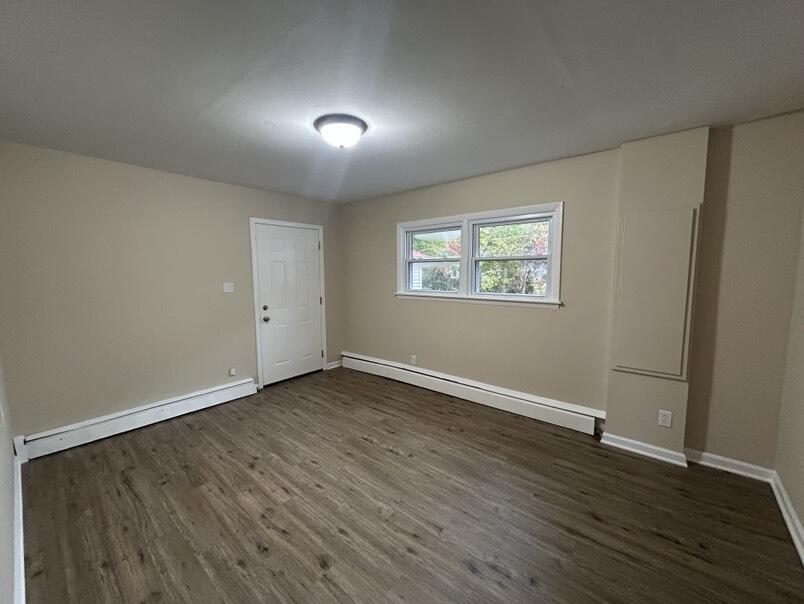 1359 State Street Hobart, IN 46342 - Photo 13 of 14 an empty room with wooden floor and windows