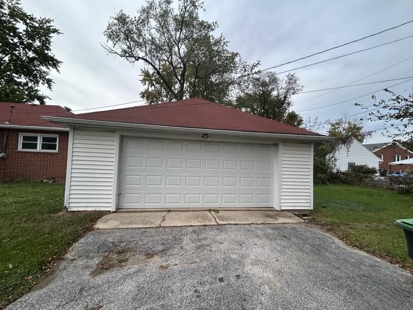 1359 State Street Hobart, IN 46342 - Photo 14 of 14 a front view of a house with a yard and garage