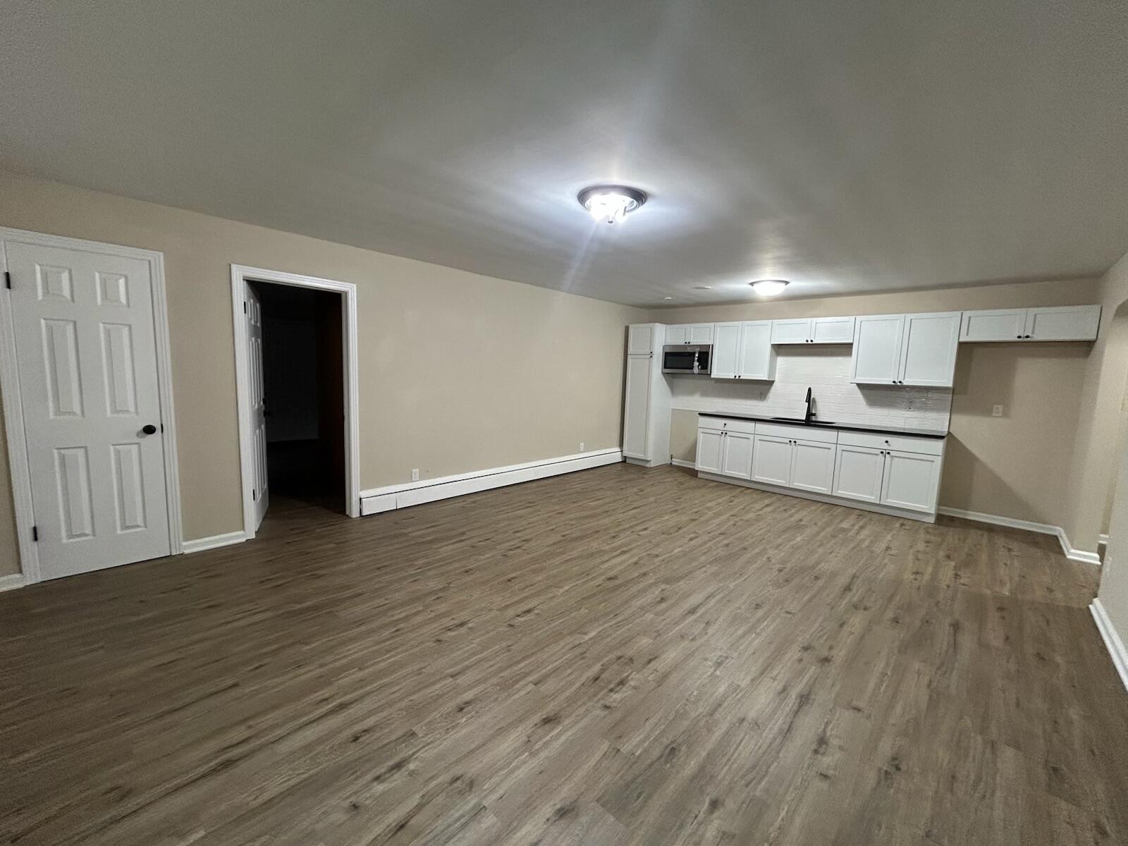 1359 State Street Hobart, IN 46342 - Photo 2 of 14 a view of a kitchen with wooden floor and a refrigerator