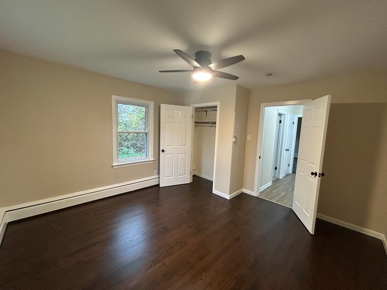 1359 State Street Hobart, IN 46342 - Photo 4 of 14 a view of an empty room with wooden floor and a window