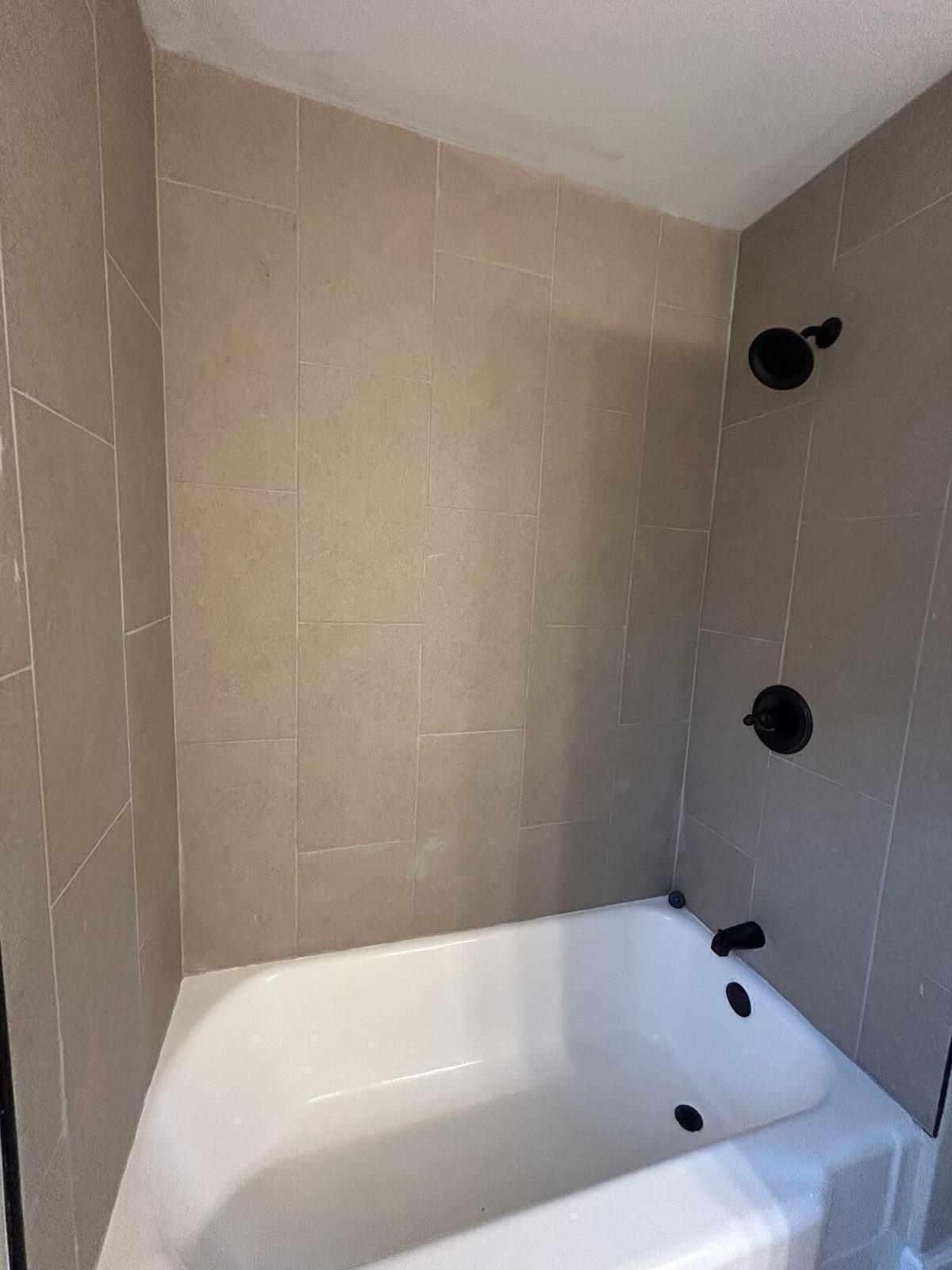 1359 State Street Hobart, IN 46342 - Photo 6 of 14 a bathroom with a tub