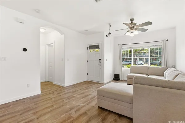 a living room with furniture and a window