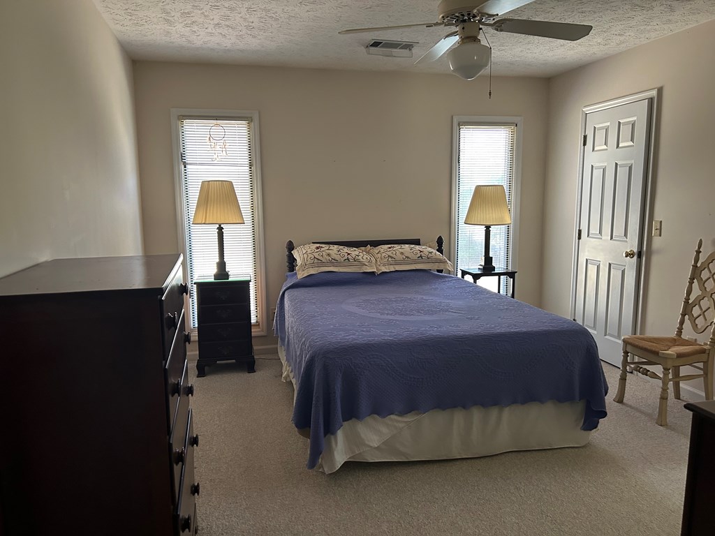 4151 Anglin Road, Unit 22C Columbus, GA 31907 - Photo 11 of 27 a bedroom with a bed and a lamp