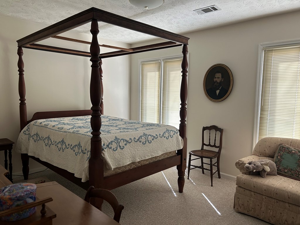 4151 Anglin Road, Unit 22C Columbus, GA 31907 - Photo 13 of 27 a bedroom with a bed a couch and a window