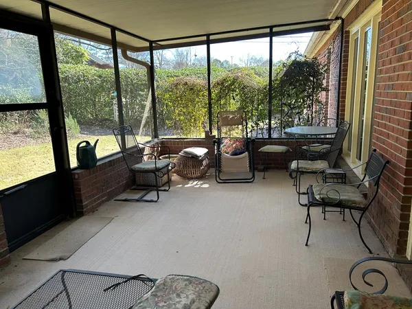 a reading room with furniture and a window