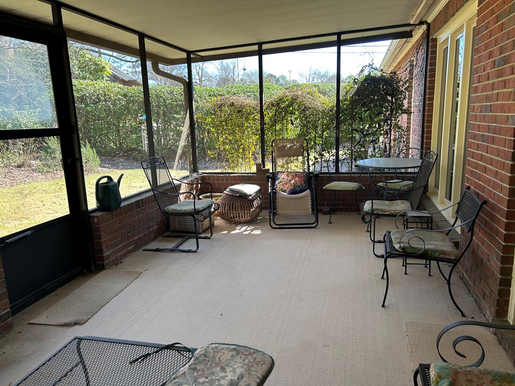 4151 Anglin Road, Unit 22C Columbus, GA 31907 - Photo 20 of 27 a living room with furniture and a floor to ceiling window
