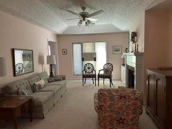 a dining room with furniture and window