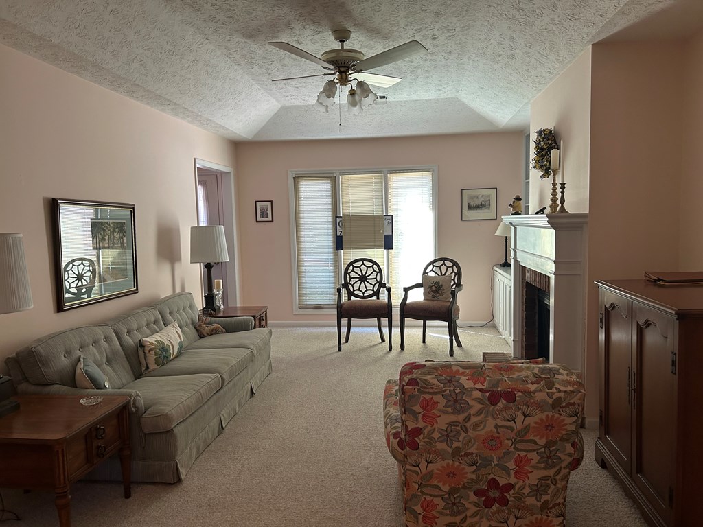 4151 Anglin Road, Unit 22C Columbus, GA 31907 - Photo 4 of 27 a living room with furniture and a chandelier