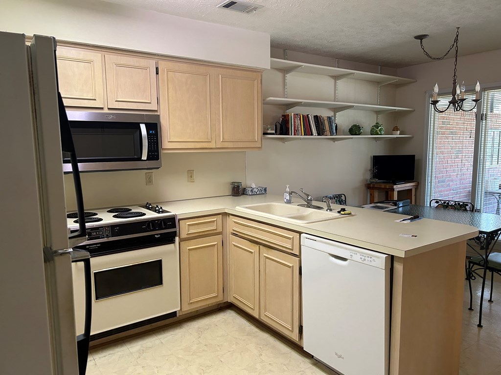 4151 Anglin Road, Unit 22C Columbus, GA 31907 - Photo 6 of 27 a kitchen with a stove and a microwave