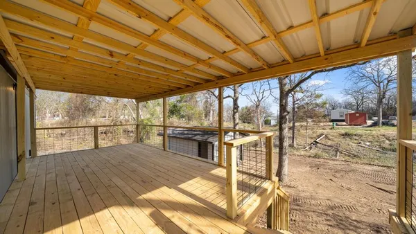 a view of a backyard with wooden floor