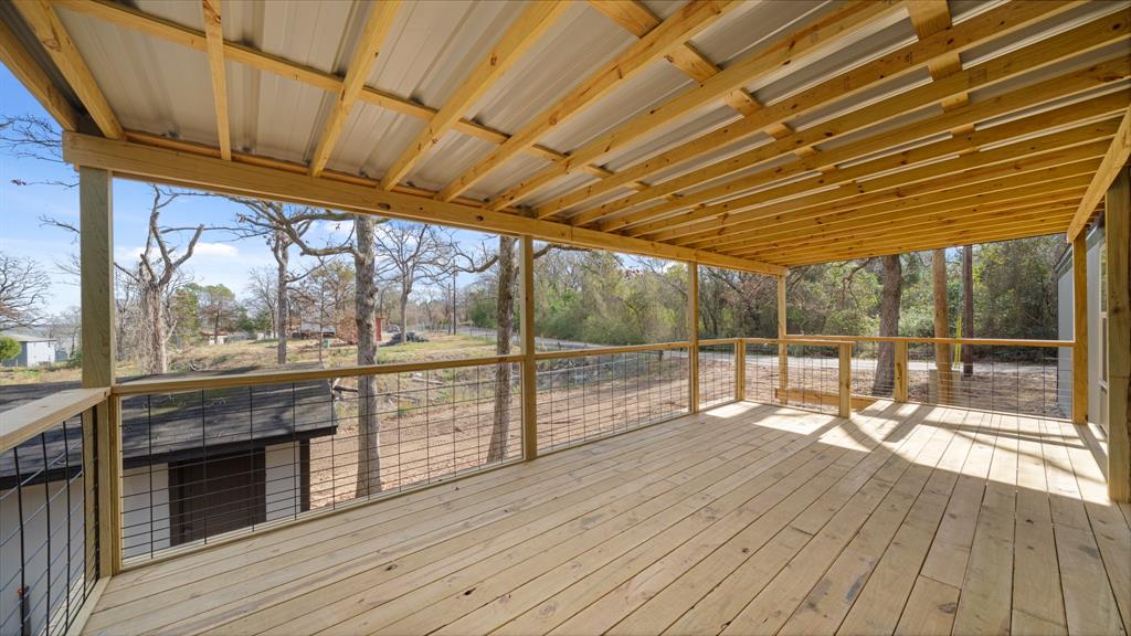 721 Queens Drive Tool, TX 75143 - Photo 23 of 30 a view of porch with wooden floor