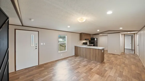 a view of a kitchen with a sink and a window