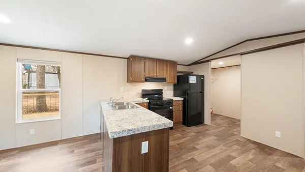 a kitchen with a refrigerator and a sink