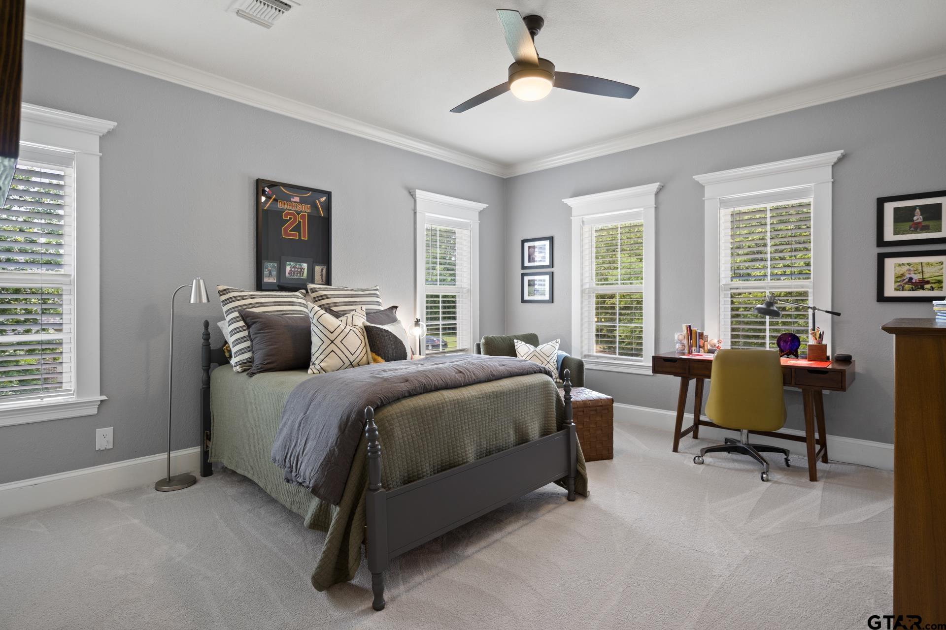 134 Private Road New Boston, TX 75570 - Photo 28 of 40 a spacious bedroom with a bed and a couch