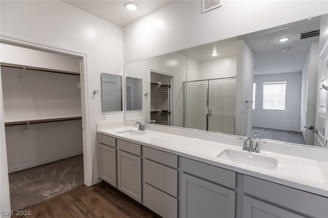 2555 Hampton Road, Unit 8206 Henderson, NV 89052 - Photo 14 of 35 This spacious bathroom offers a double vanity and a walk-in closet for comfort and convenience.