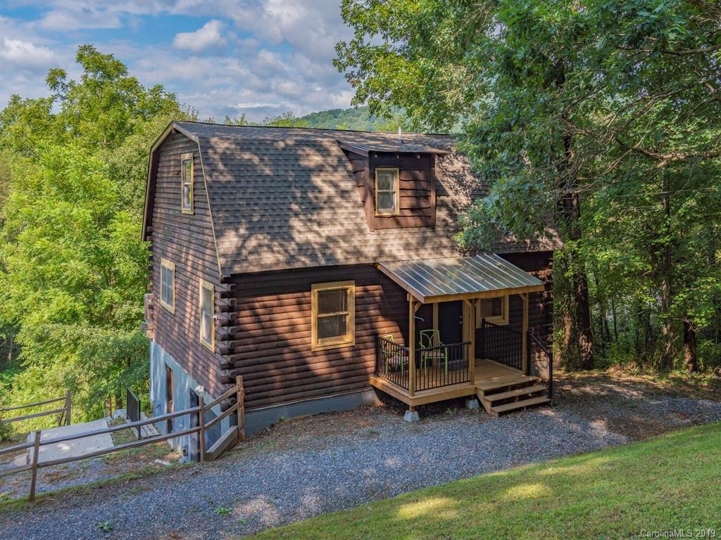 119 Loop Road Clyde, NC 28721 - Photo 1 of 18 a view of a house with a yard