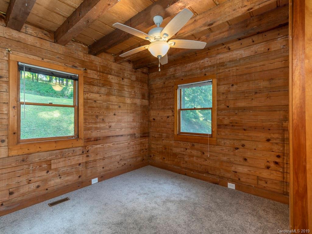 119 Loop Road Clyde, NC 28721 - Photo 11 of 18 a view of an empty room with a window