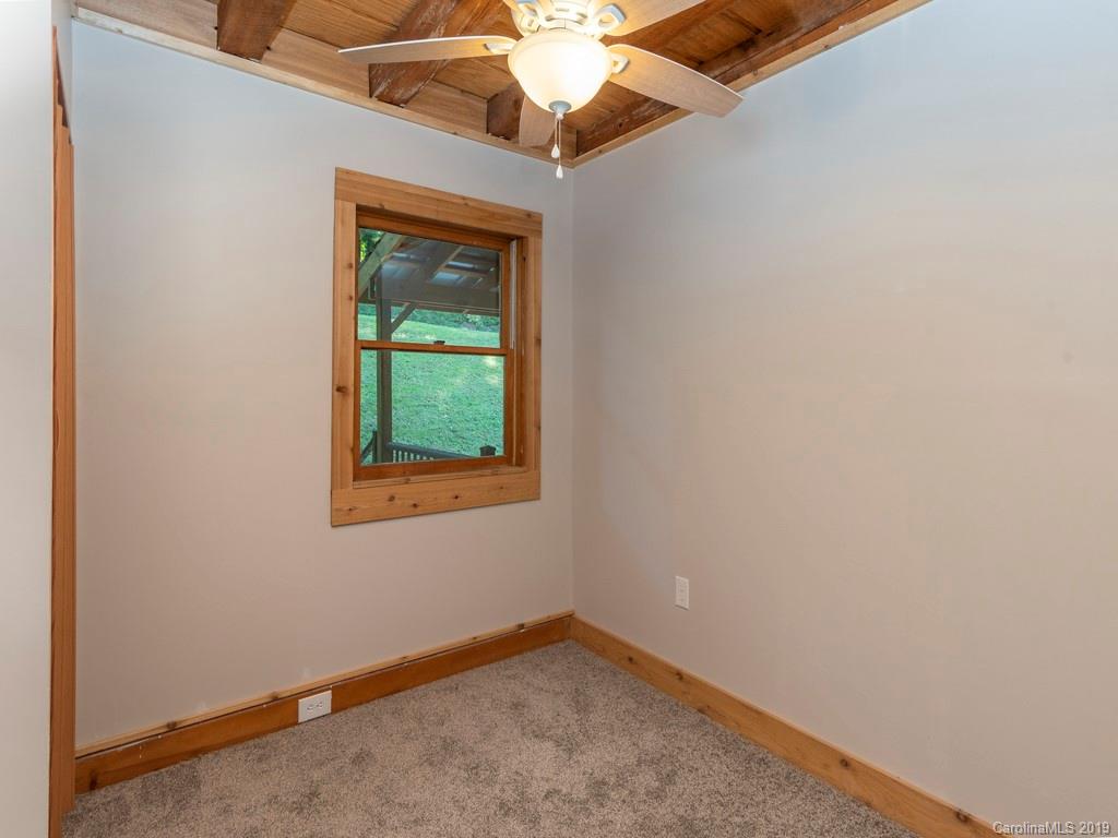 119 Loop Road Clyde, NC 28721 - Photo 9 of 18 a view of an empty room with a window