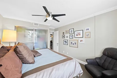 a bedroom with a large bed and a couch