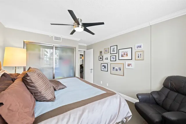 a bedroom with a large bed and a couch