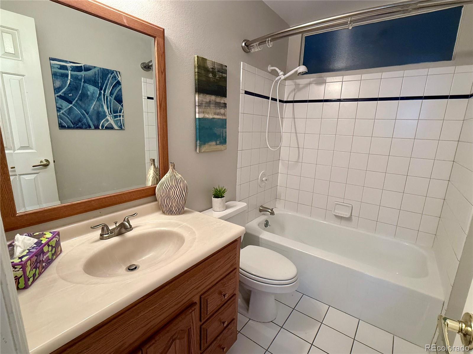6272 South Garfield Drive Centennial, CO 80121 - Photo 25 of 37 a bathroom with a sink a toilet and shower